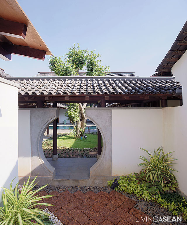 A stand-alone house of Buddha serves as a reminder of Thai architecture in earlier times.