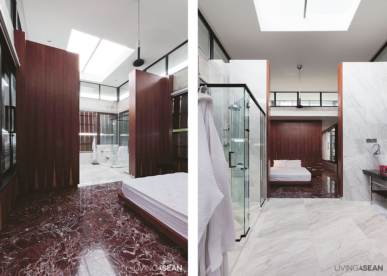 Different color marble floors mark the boundaries between the bedroom and the adjoining bath.
