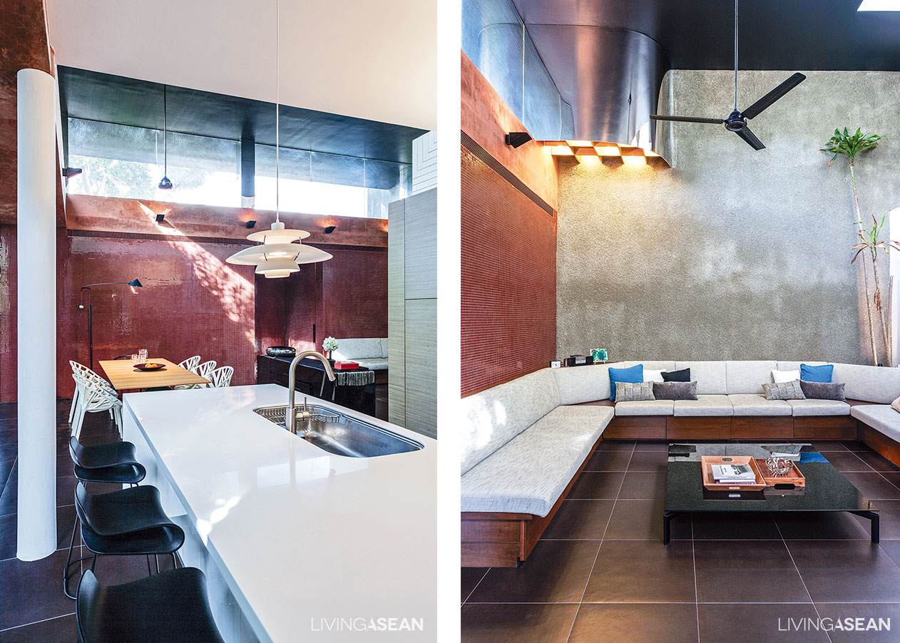 [Left] An open kitchenette connects with the dining room making the area look neat and uncluttered, while a warm shade of brown and burgundy on the wall contrasts with modern furniture. / [Right] A U-shaped sectional sofa is set against the wall to maximize space. 