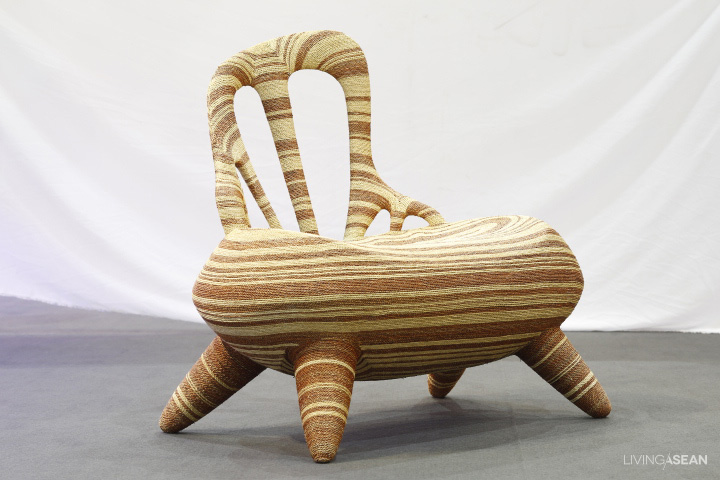 Lightweight vetiver grass is fashioned into unusual curves in this unique chair. 