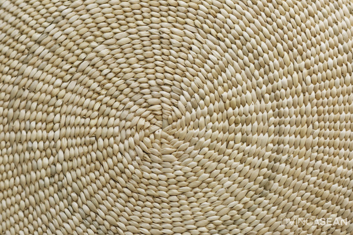 Grasses are woven into a circular form.