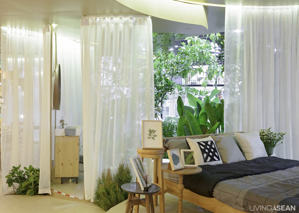 A hint of greenery blends into the bedroom. 