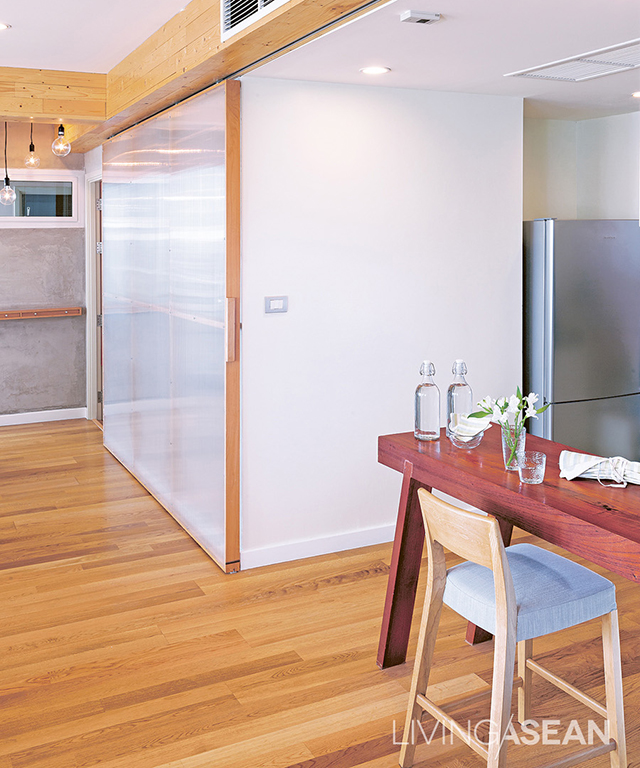 A sliding door partitions off the kitchen, and a counter divides usable space.