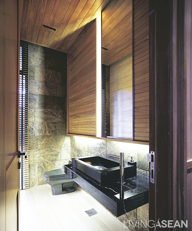 A bathroom décor of natural wood, which blends well with white and gray.