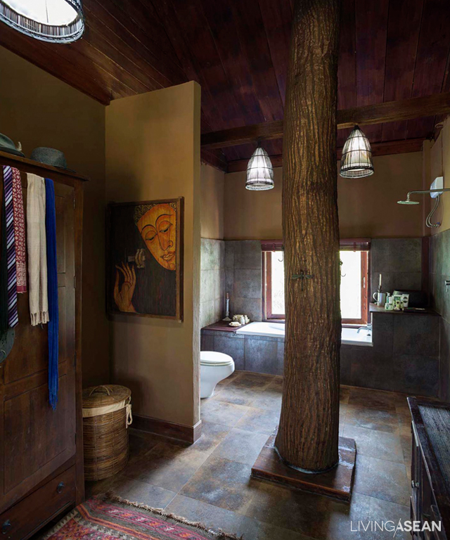 The house with a twist features a tree trunk that continues to grow through the floorboard. A clever design element, the tree had been there long before the owners decided to put in a home. Not wanting to cut it down, they built their home around the tree and let it keep on growing. They are just happy to live and let live despite having to adjust the floorboard and roofing from time to time.