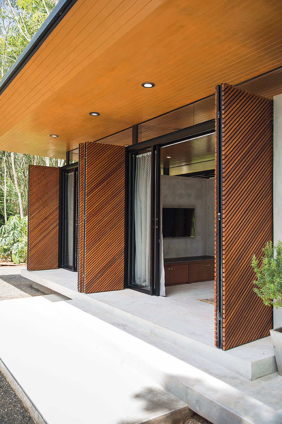 Steel House in a Rubber Forest