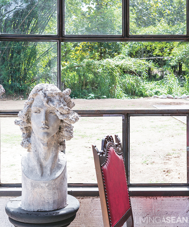 A human head bust on display inside the studio home has a raw, rugged look to it.