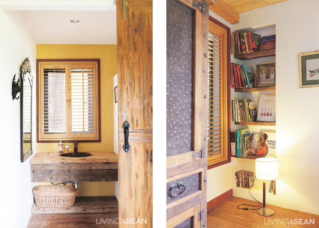 [Left] A bathroom countertop crafted of reclaimed wood brings out the beauty of raw natural textured finishes. [Right] An old bookshelf speaks volumes for the homeowner’s personal interests. It’s filled with publications on guitars, boats, and Safari style decor. All things considered, it is a small world embracing Safari themes and colors that Piset has come to love. It is a living space rich in spirits of adventure and memories of enchanting experiences.