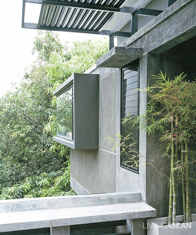 Poured concrete window frames that extend outward add artistry to the building both inside and out.