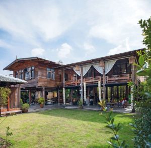 Wooden House with Thai-style “Tai Thun”