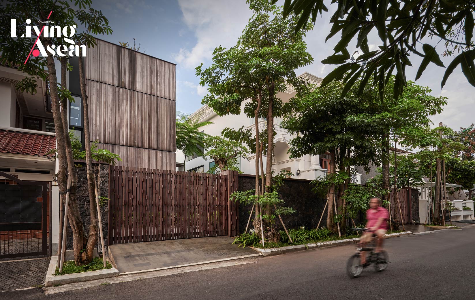 A Wood Façade House Nestled in the Beauty of a Tropical Garden